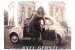 Postcard "Fiat 500 and a young woman in front of a church"